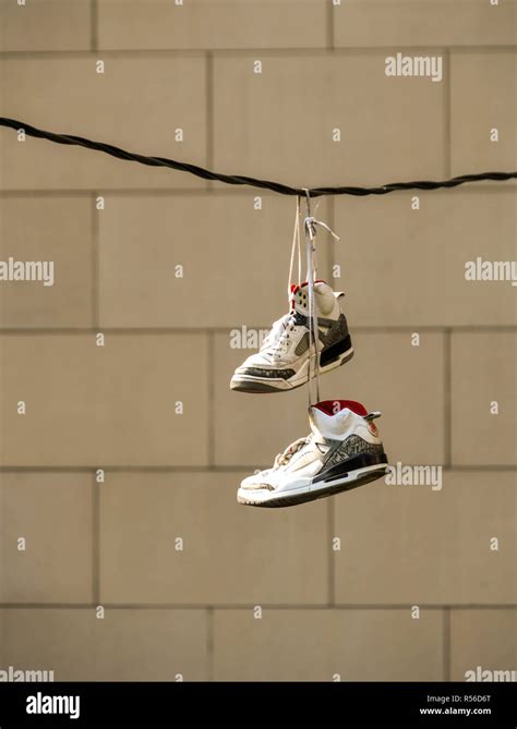 shoes hanging over wire.